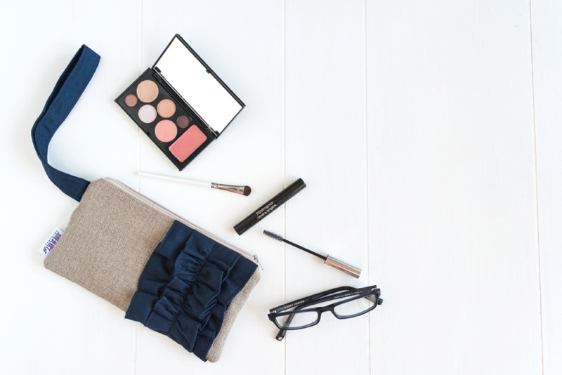 Etsy product photography and styling bag makeup glasses